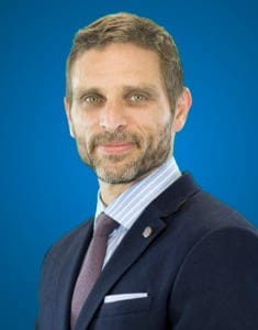 Professional headshot of Jeff Blumberg, a middle-aged man with short dark hair smiling confidently in a suit.