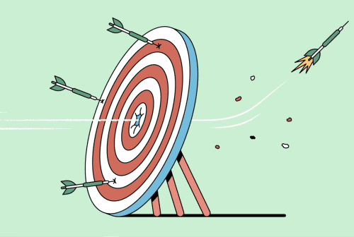 A target with darts flying toward it, one hitting the bullseye.