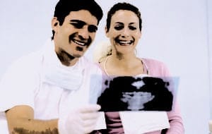 A professional checking the time on a wristwatch in an office.