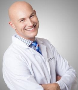 Portrait of Dr. Ken Cirka, DMD, a smiling dentist in professional attire.
