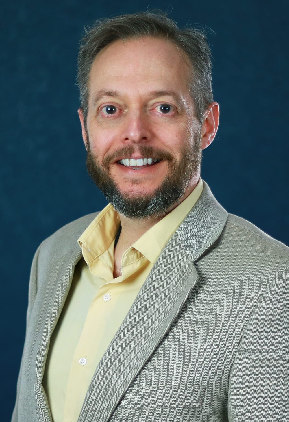 Portrait of Chris Menkhaus, a dental consultant.