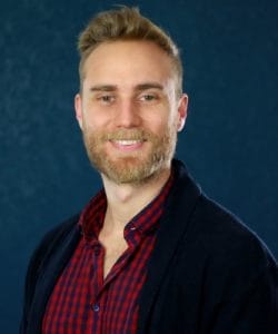 Adam headshot photo.