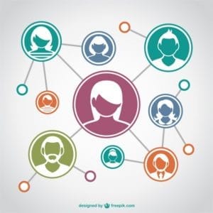 Professionals networking and exchanging business cards at an event.