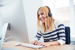 Illustration comparing answering service options to in-office receptionist handling calls.