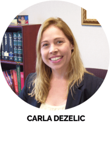 A professional woman standing in a modern dental office.