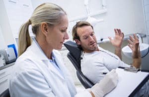 A dental patient expressing complaint about treatment.