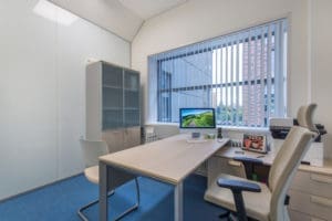 Dental professionals in a clean office environment preparing for patient consultation.