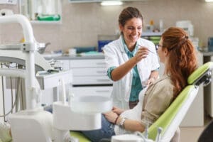 Dentist performing a dental examination on a patient.