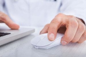 A dental professional in a clinical setting.