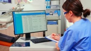 Dentist scheduling appointment with patient.