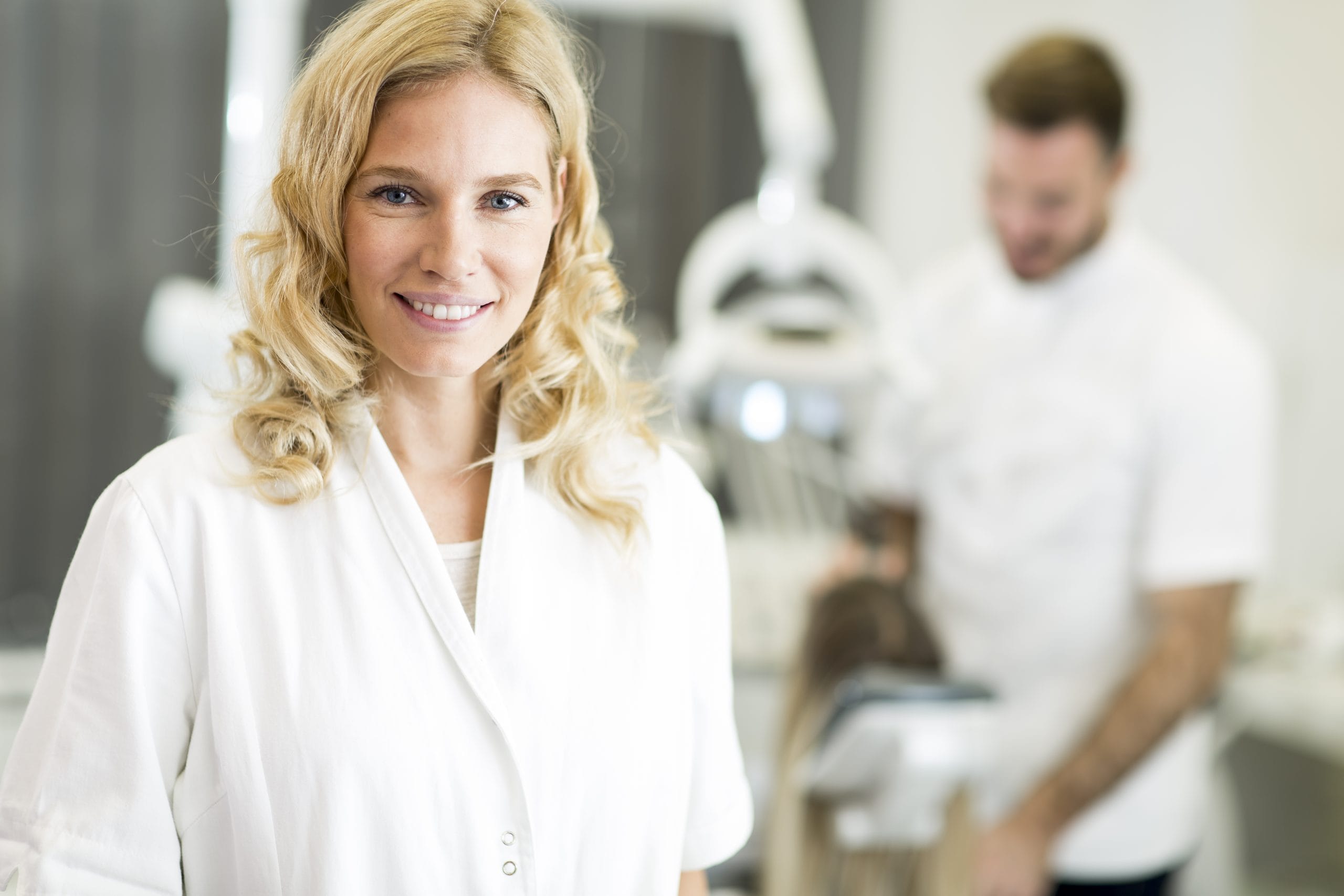 Attractive blonde female dental worker.