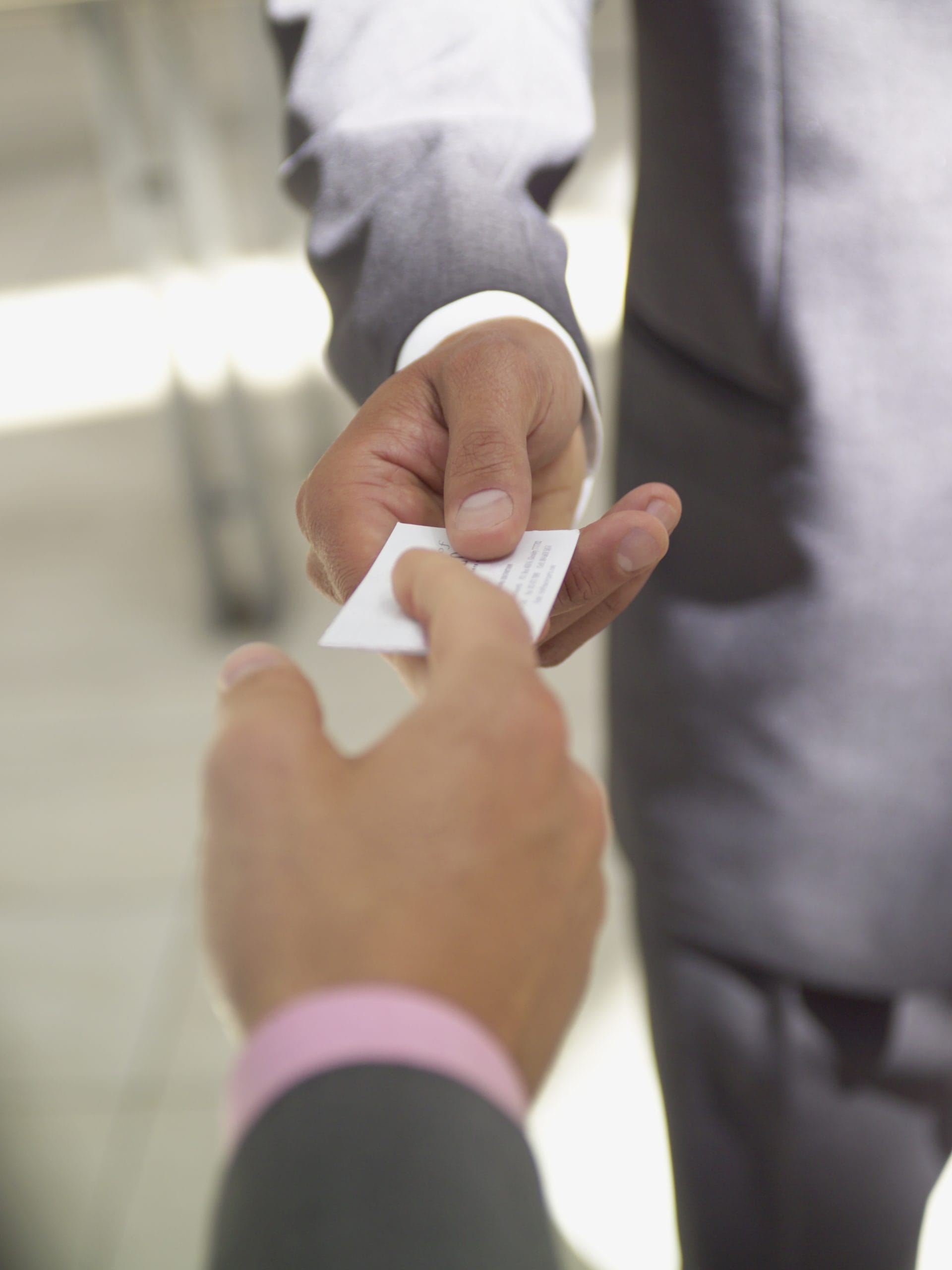 Business people exchanging cards.